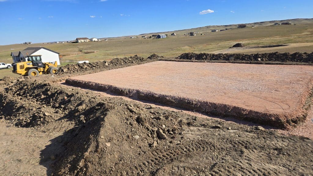 Excavation of a residential lot for concrete foundation work.